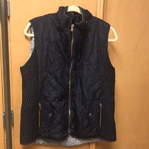 Navy blue shirt under vest
